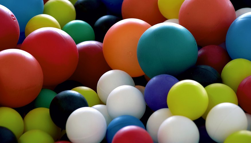 Photo Credit: Photos.com/Photos.com/Getty Images A binomial table can help you figure out the probability of choosing a red ball.
