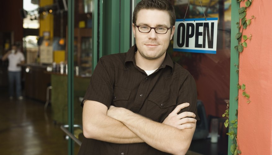 Man standing in doorway of coffee shop