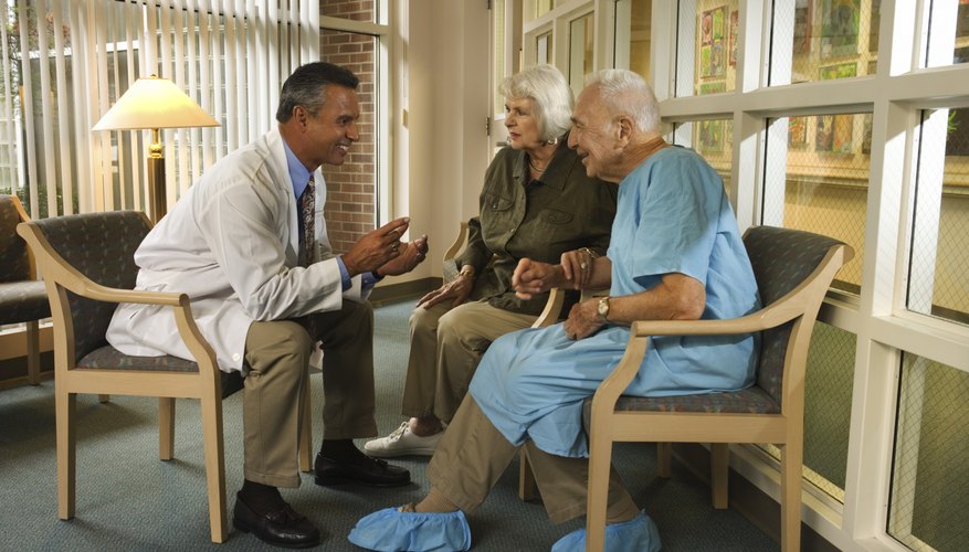 Doctor talking with senior couple