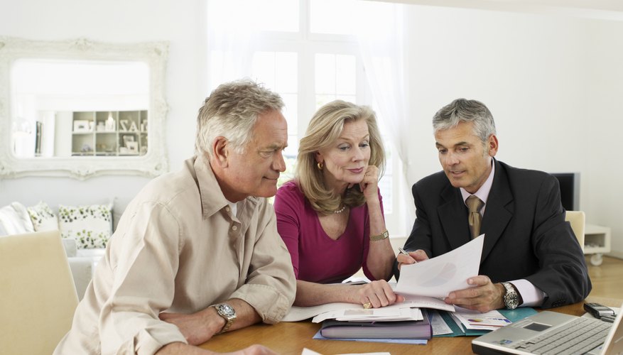 Senior citizens looking at tax paperwork
