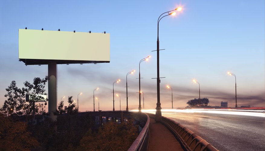 Photo Credit: Pavel Losevsky/iStock/Getty Images Blank billboard along highway