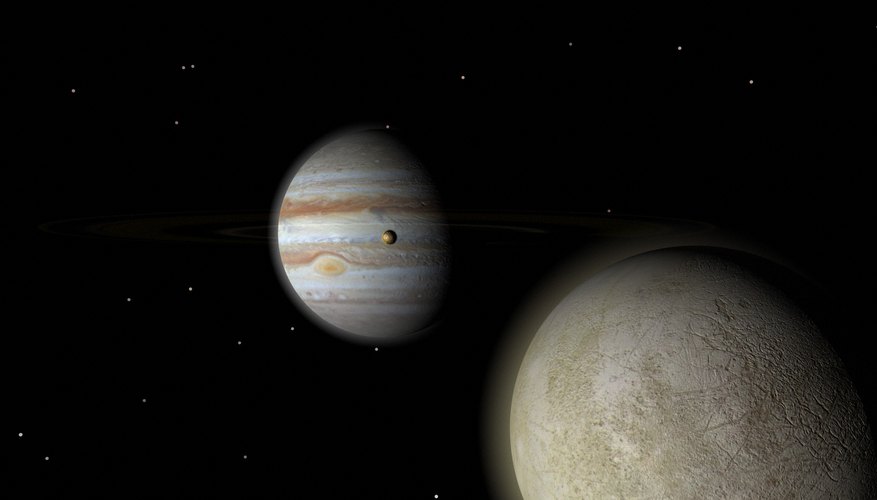 Europa and Io, two of Jupiter's moons, circle the planet. Europa and Io, two of Jupiter's moons, circle the planet.