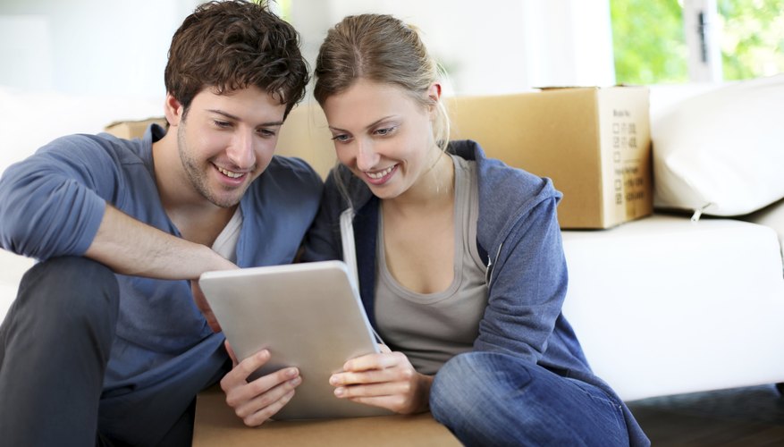 A young couple goes over the lease for their newly rented apartment