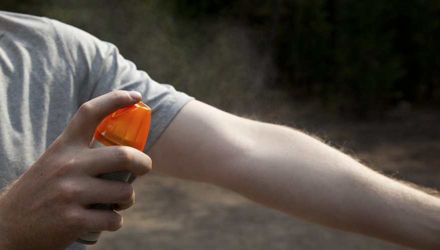 Insect repellent sprayed on arm Insect repellent sprayed on arm