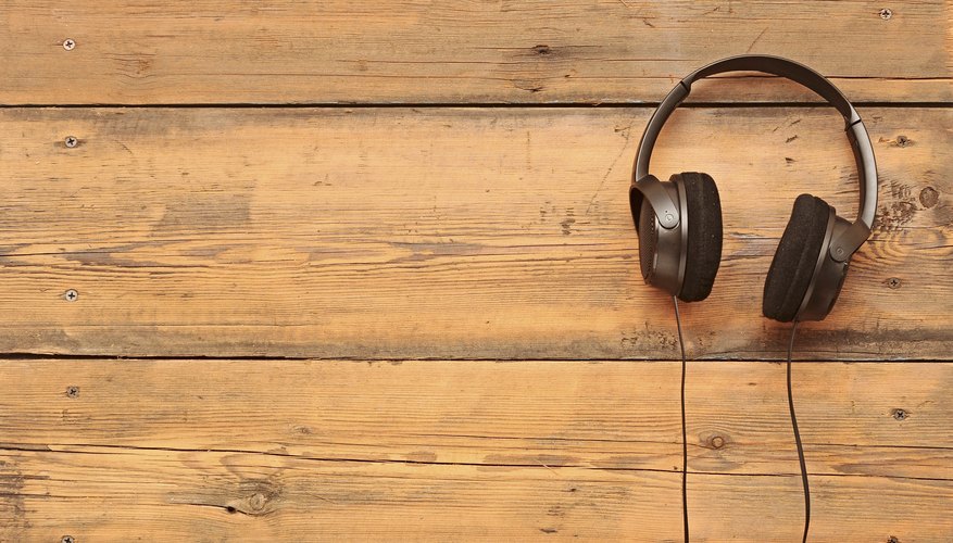 stylish headphones on a grungy wooden table