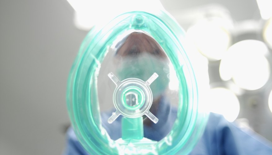 Anesthesist holding a mask Anesthesist holding a mask