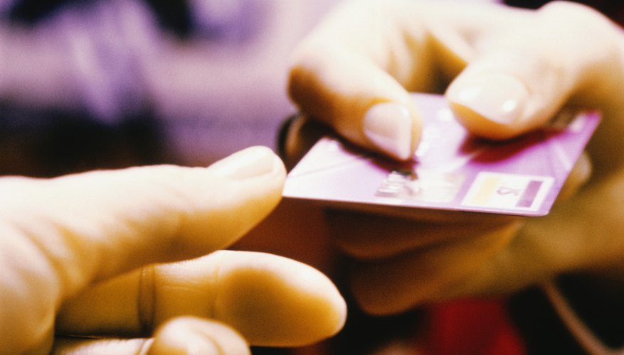 Handing over a debit card.