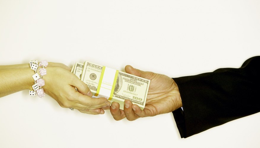 Photo Credit: Jupiterimages/Photos.com/Getty Images Record the amount of the payment.