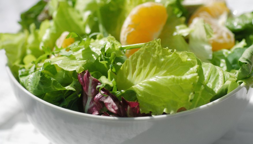 A bowl of salad with mandarin oranges. A bowl of salad with mandarin oranges.