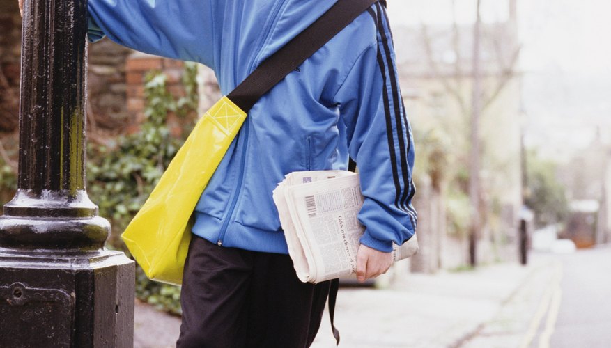 Your child may need to file a tax return for his paper route income.