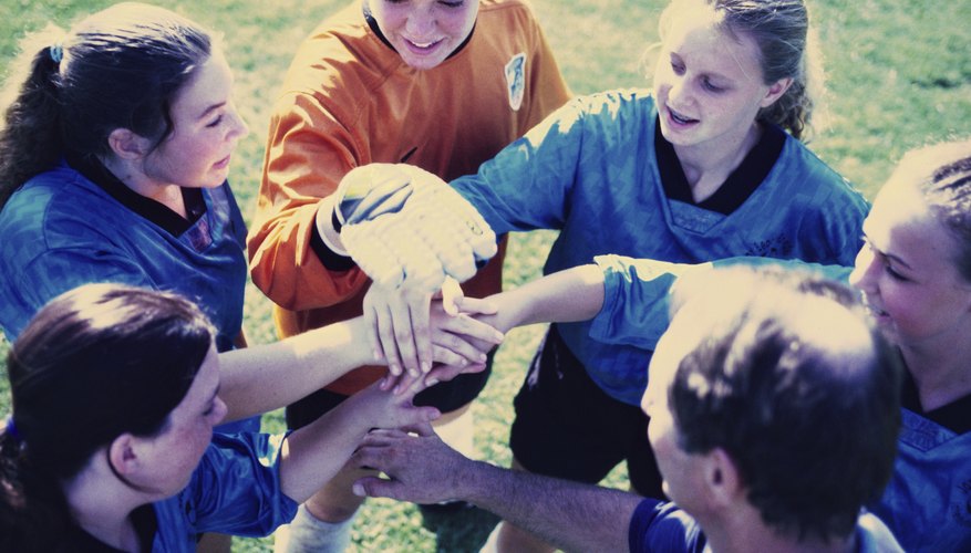 Group of teens playing soccer Group of teens playing soccer