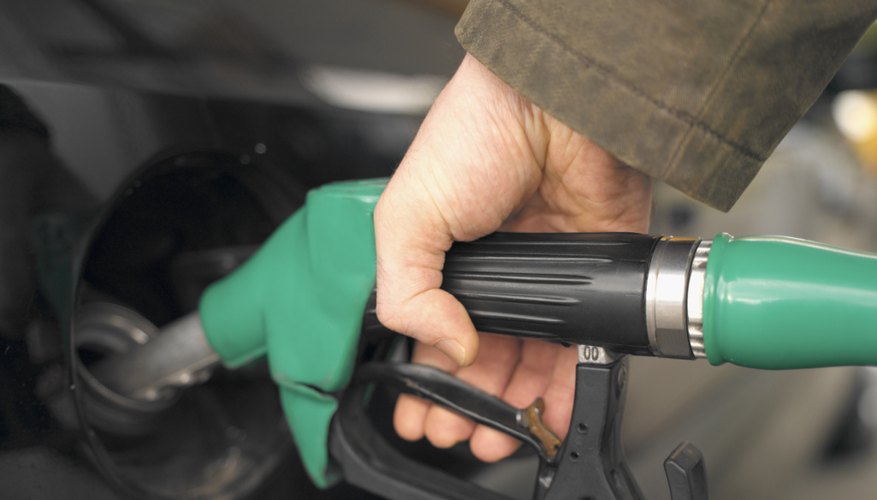 close-up of a person's hand holding a fuel pump