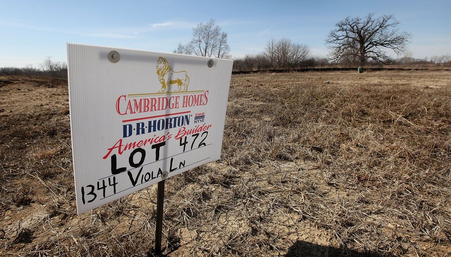 A sign advertising a vacant lot for sale.