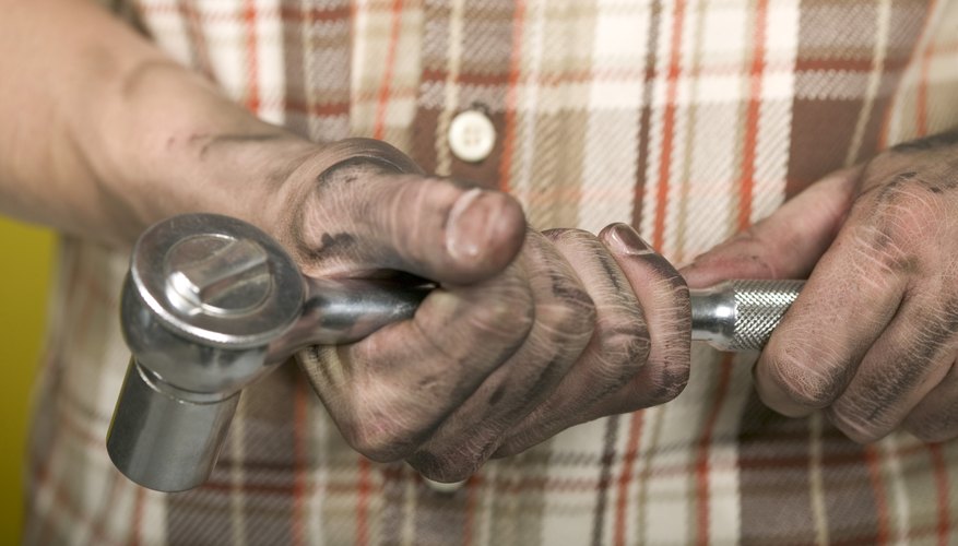 Hand holding socket wrench