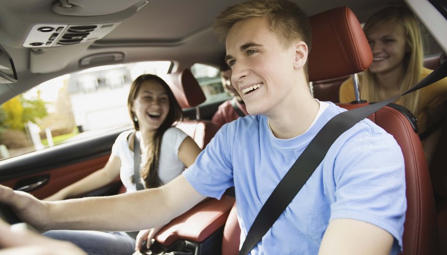 Smiling teenagers in a car