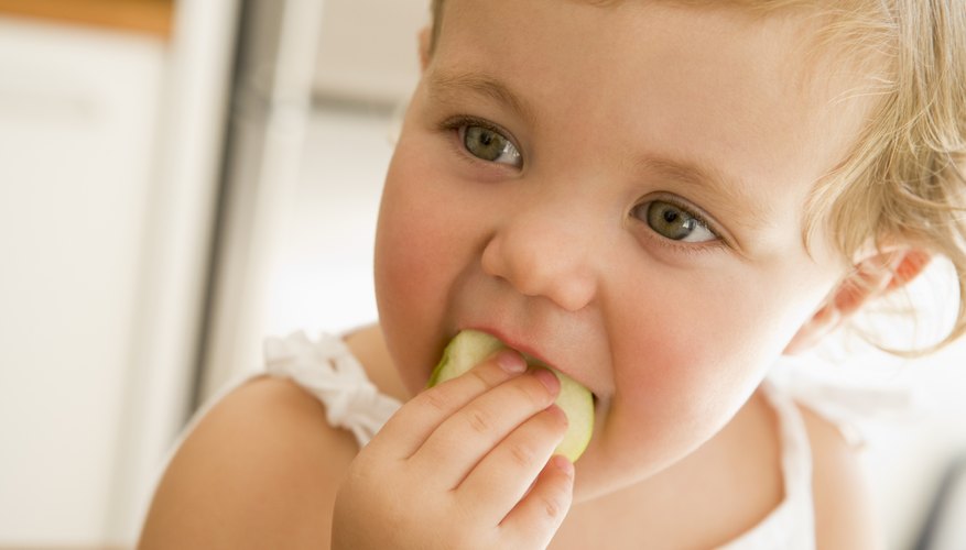 Young girl eating an apple Young girl eating an apple