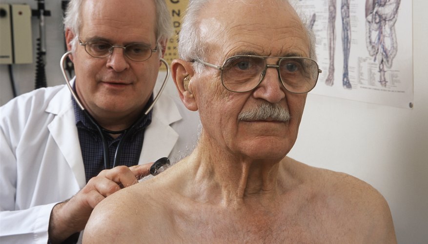 Elderly patient being examined by a doctor.