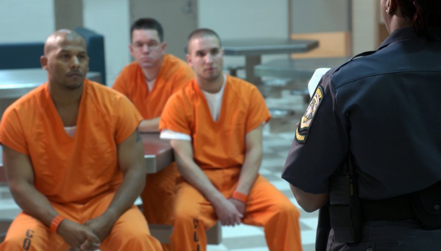 Guard talking to prisoners