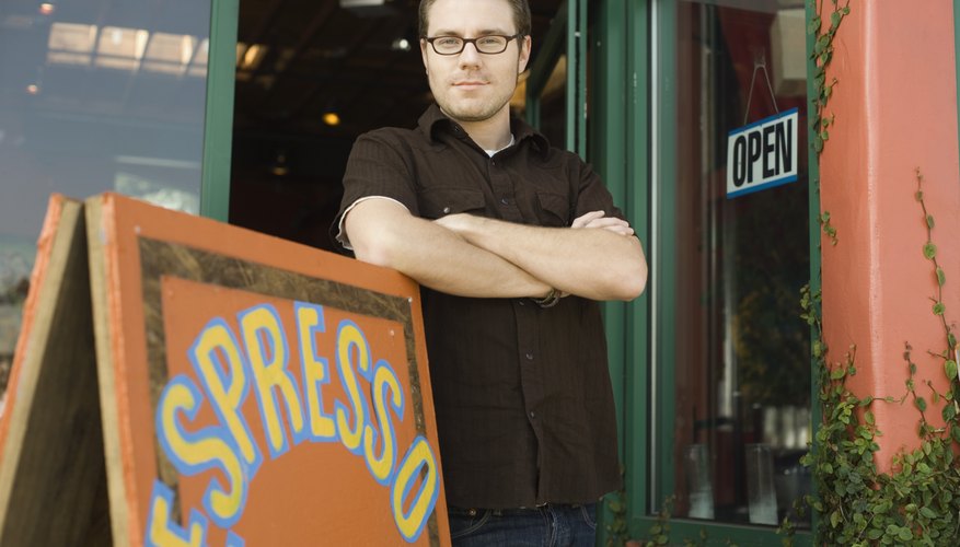 Man standing in doorway to coffee shop
