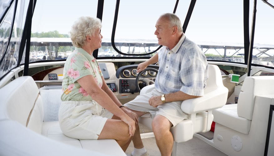 Senior couple talking on boat Senior couple talking on boat