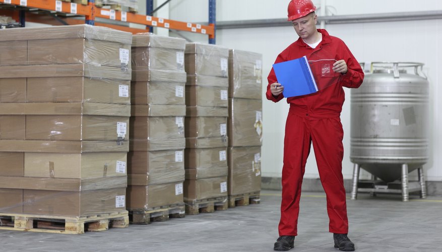 worker checking list of products