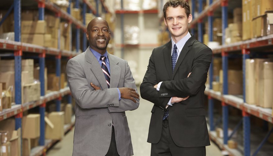 Portrait Of Two Businessmen In Warehouse
