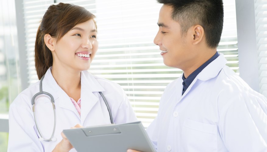 Photo Credit: DragonImages/iStock/Getty Images Doctors laughing