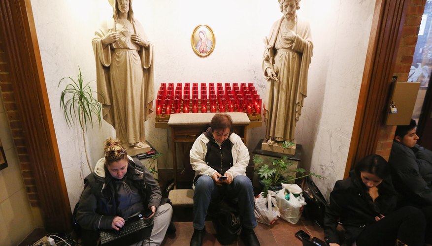 Photo Credit: Mario Tama/Getty Images News/Getty Images People rest and charge devices at a shelter for those affected by Superstorm Sandy at Saints Peter and Paul Church on November 1, 2012 in Hoboken, New Jersey.
