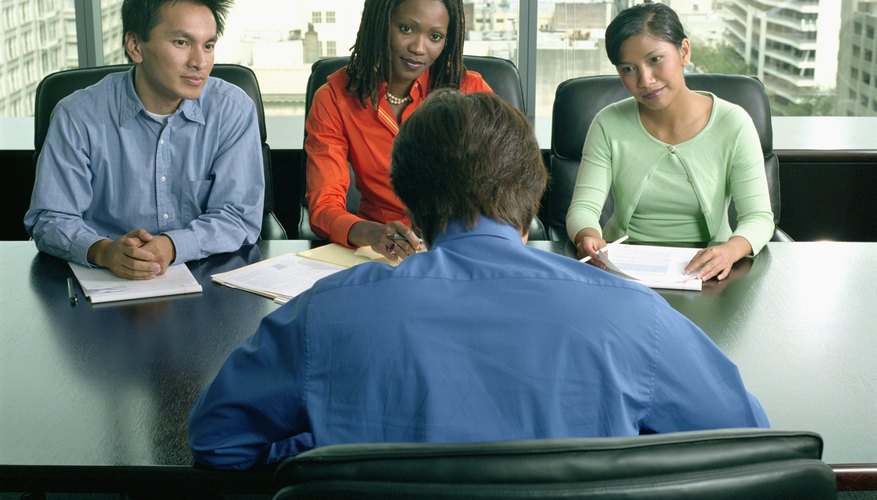 High angle view of four business executives in a meeting
