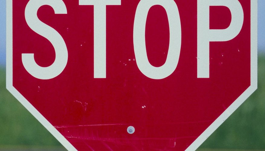 Photo Credit: Jupiterimages/Photos.com/Getty Images Stop signs are regular octagons with both types of diameters.