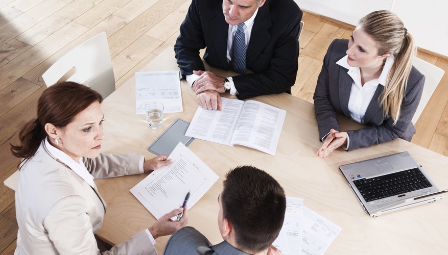 Four businesspeople having a meeting in conference room