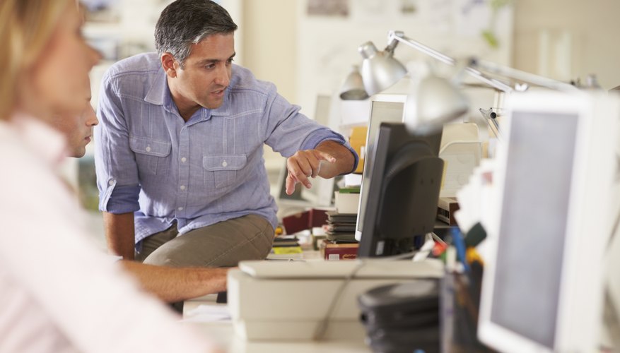 Photo Credit: Catherine Yeulet/iStock/Getty Images Marketing director at work