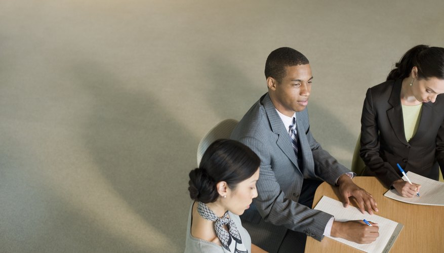 office workers at meeting table
