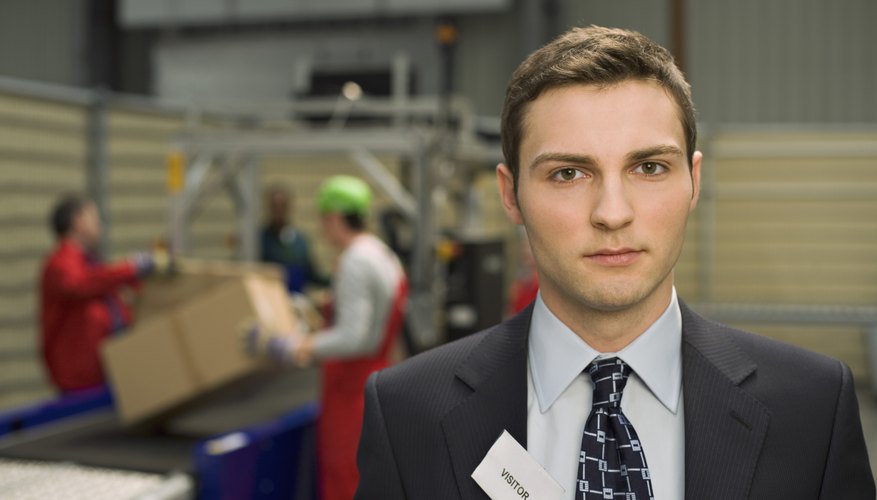 Businessman wearing visitor badge