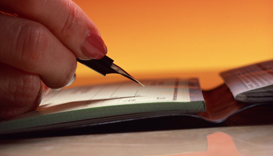Writing a check for more than your balance can drop your account into the red.