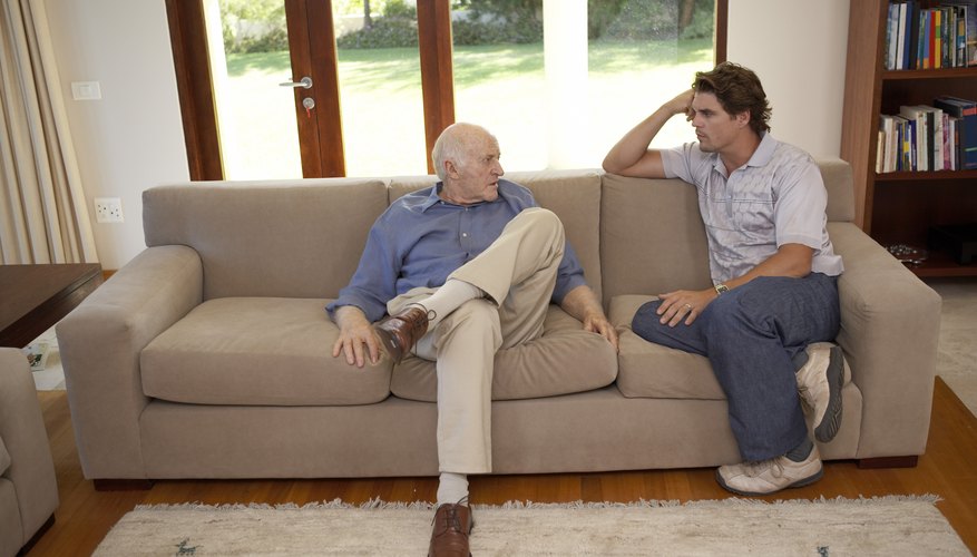 Men talking on couch Men talking on couch