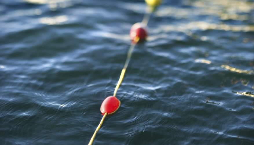 Photo Credit: Thinkstock/Comstock/Getty Images Buoys float because their density is less than that of water