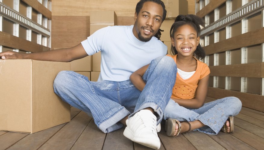 Photo Credit: Picturenet/Blend Images/Getty Images Father and daughter in portable storage unit