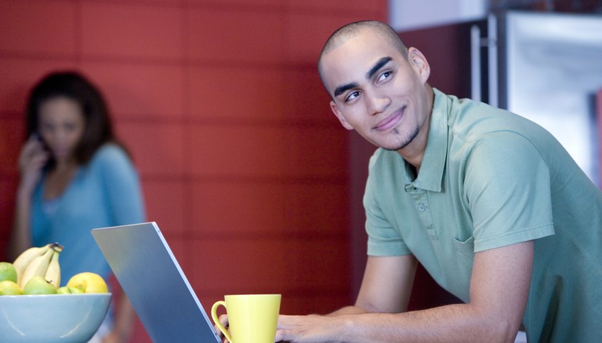 African American man typing on laptop