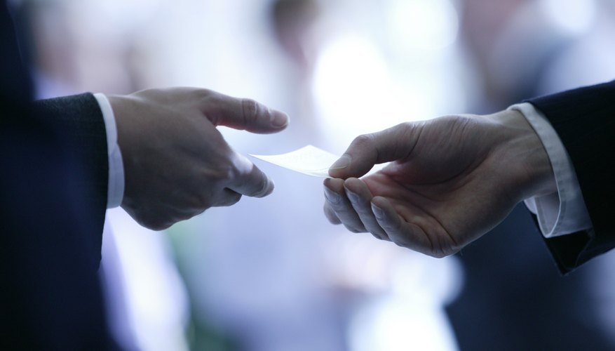 Hands with business card