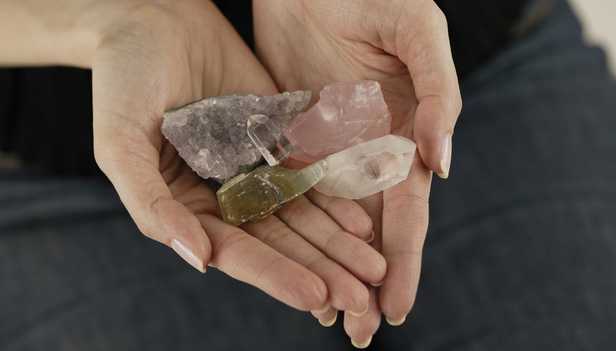beautiful hands holding crystals gems