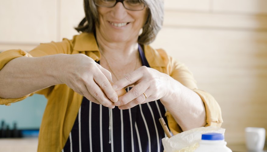 Woman cracking egg