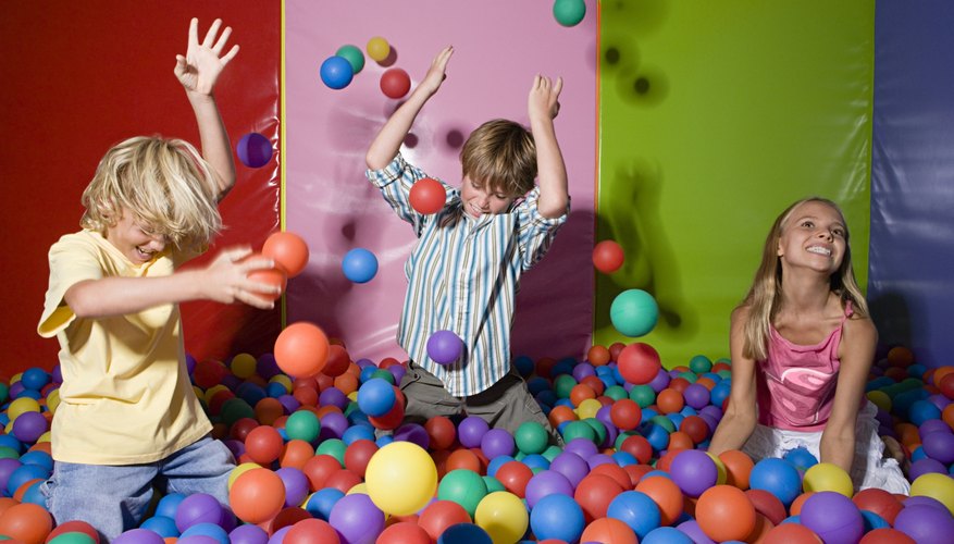 Photo Credit: Image Source/Digital Vision/Getty Images Children playing with balls