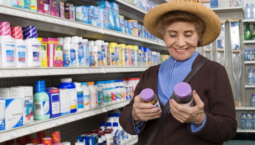 Customer looking at bottles of medication