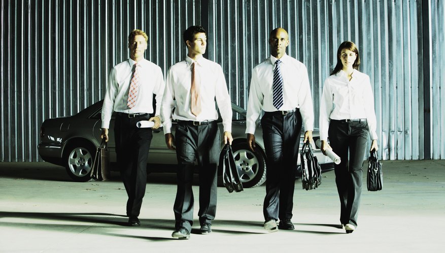 Businesspeople walking from car