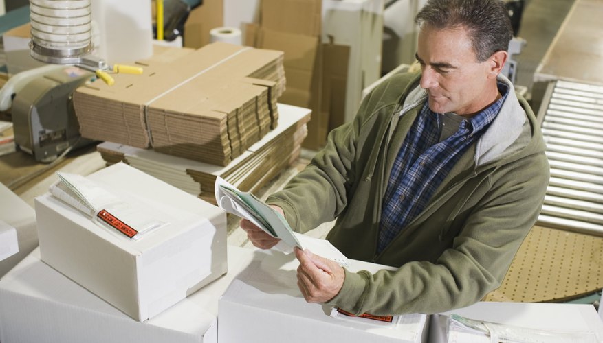 Warehouse worker reading document