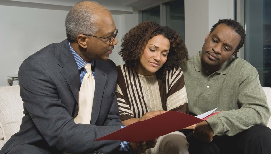 A married couple consults with a life insurance salesman