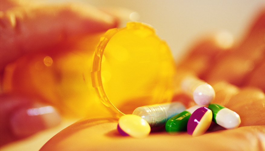 Various pills in a woman's hand Various pills in a woman's hand