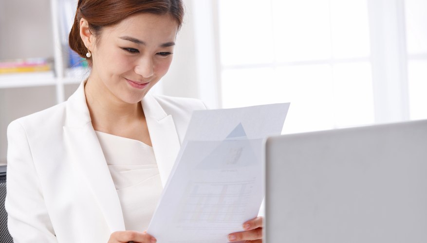 Young business lady reading report