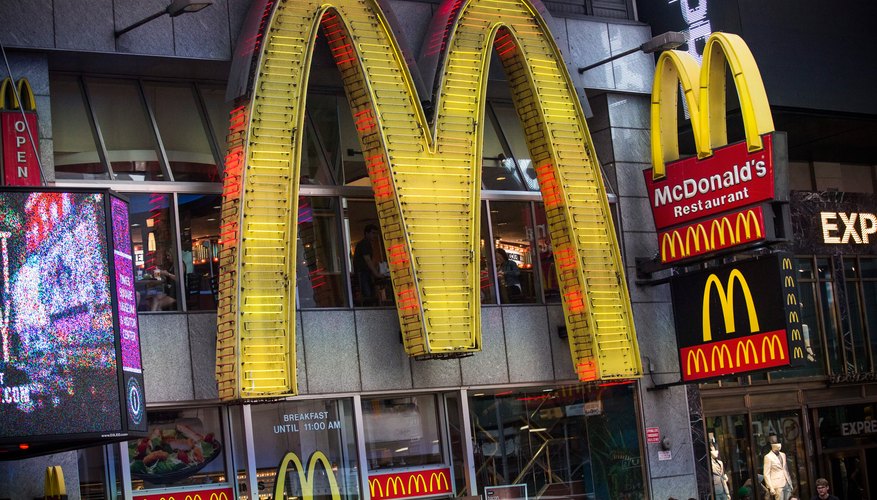 Photo Credit: Andrew Burton/Getty Images News/Getty Images Bright, light-up McDonalds sign